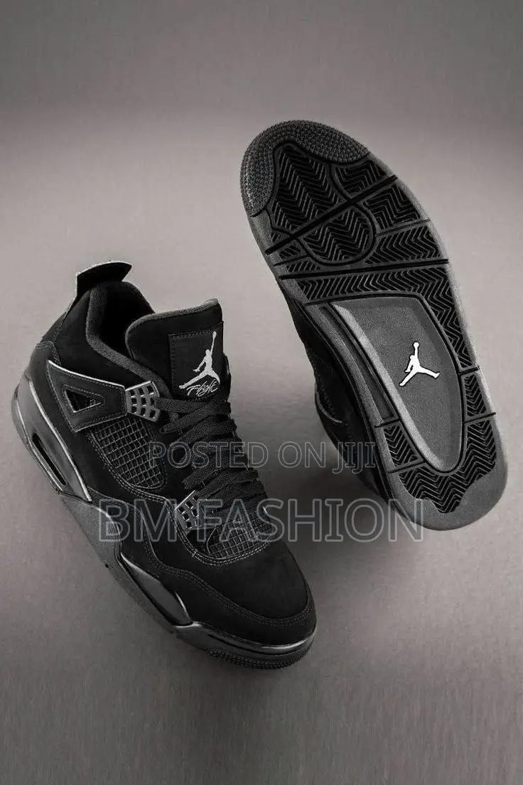 Air Jordan 4 Retro Sneakers in a Black and Light Graphite Colorway