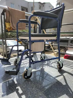 Photo - Commode/Transfer Chair Has a 150kg Capacity Comes Drop-Down Armrests