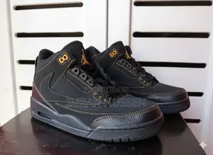 Photo - Premium Black Mid-Top Sneakers – Gold Stitch Edition