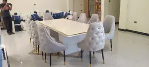 የገበታ ጠረጴዛ ከ አስር ወንበር ጋር