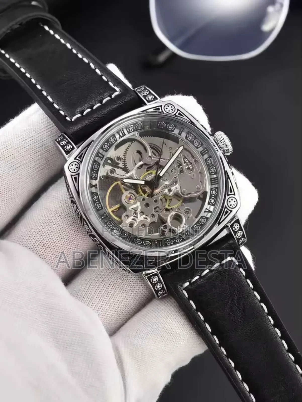 Skeleton Automatic Watch With a Silver-Tone Case and a Black Leather