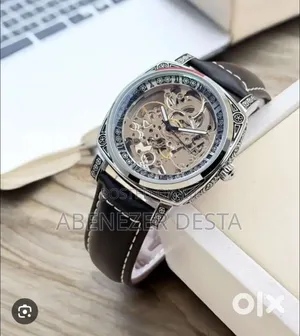 Skeleton Automatic Watch With a Silver-Tone Case and a Black Leather