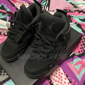 Photo - “Black Cat” Nike Air Jordan 4 Retro — Women