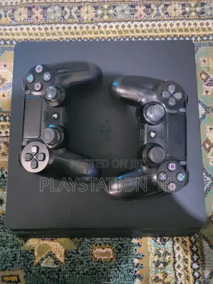 Photo - P S 4 Slim Playstation 4 እንገዛለን