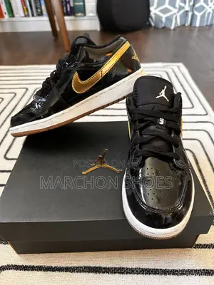 Photo - Air Jordan 1 Retro Low “Black Metallic Gold”