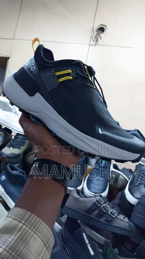 This Is a Blackout White Nautica Slip-on Athletics Sneakers