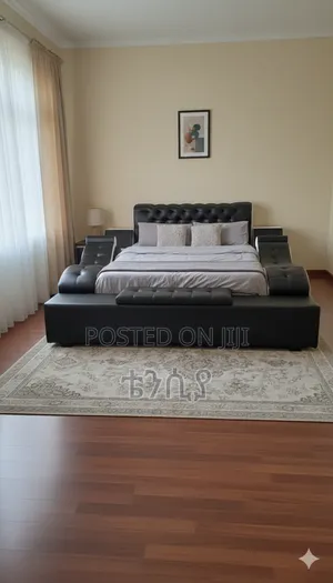 Photo - Premium Leather Tufted Bed
