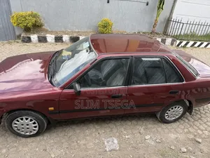 Photo - Toyota Carina 1996 Burgundy