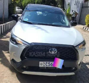 Photo - Toyota Corolla Cross Hybrid S AWD 2023 White