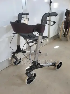 Photo - Walking, Featuring Four Wheels, a Seat With a Backrest Hand Brakes