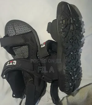 Photo - This Is a Pair of Black Nymbler Brand Slide Sandals in Size