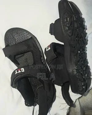 This Is a Pair of Black Nymbler Brand Slide Sandals in Size