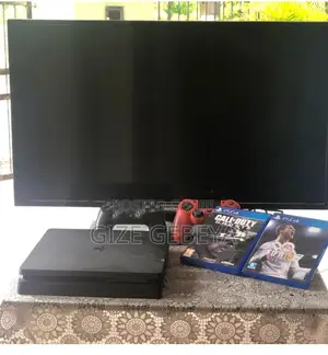 Photo - Ps4 With Tv and Joystick
